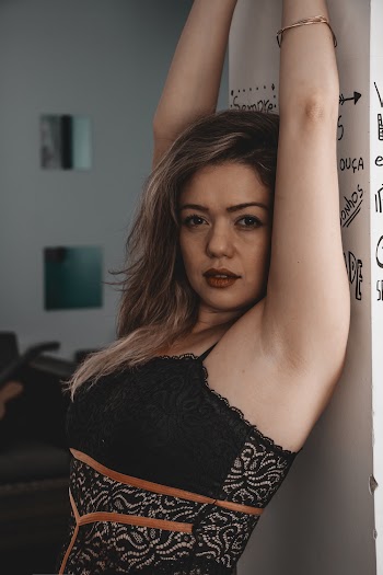Woman Leaning on Wall