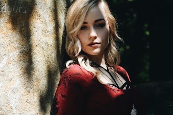 woman leaning on wall