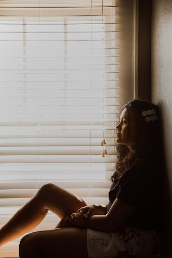 Woman Leaning on Wall