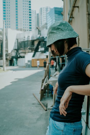 Woman Leaning on Wall