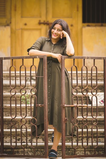 Woman Leaning on Wall