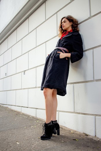 Woman Leaning on Wall