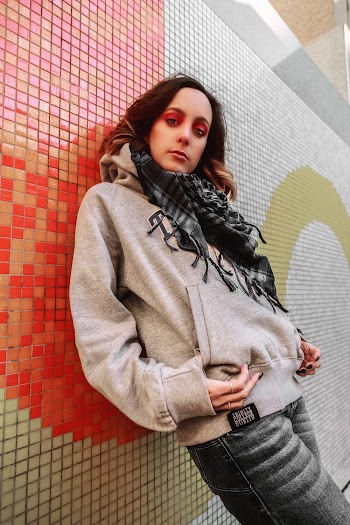 Woman Leaning On Wall