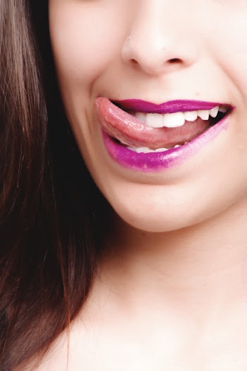 Woman Licking With Purple Lips