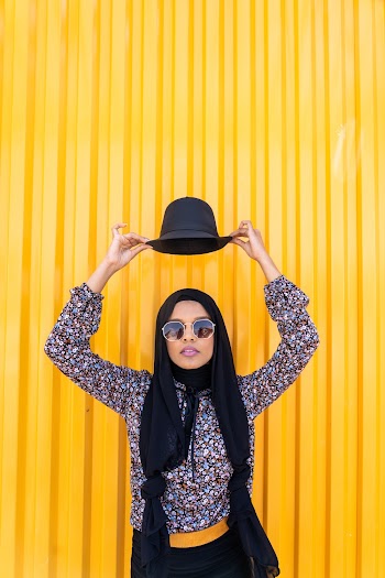 Woman Lifting Her Hat