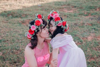 Woman Looking at Girl Outdoors