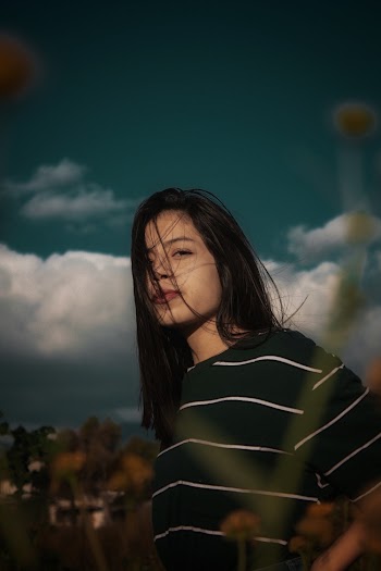 Woman Looking at Her Left Near Plants