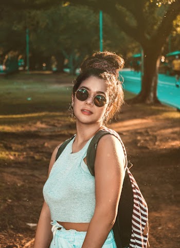 Woman Looking at Her Left Near Trees and Road