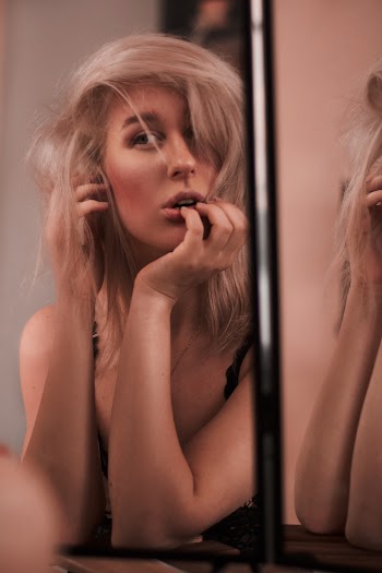Woman Looking at Mirror