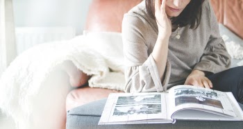 Woman Looking at Photo Album