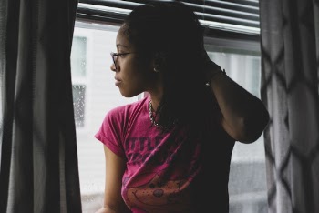 Woman Looking Out The Window