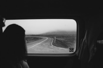 woman looking outside automotive window