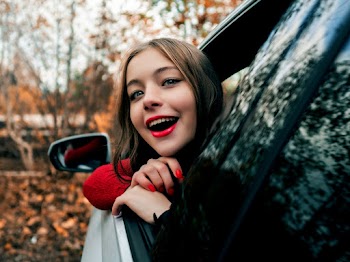 Woman Looking Outside Vehicle's Window