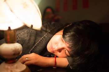 Woman Looking to the Lamp
