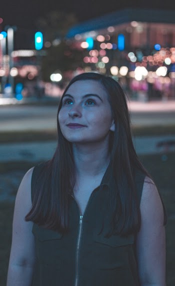 Woman Looking Up during Night