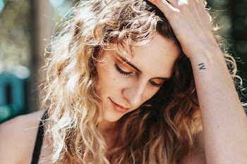 Woman Looks Down
