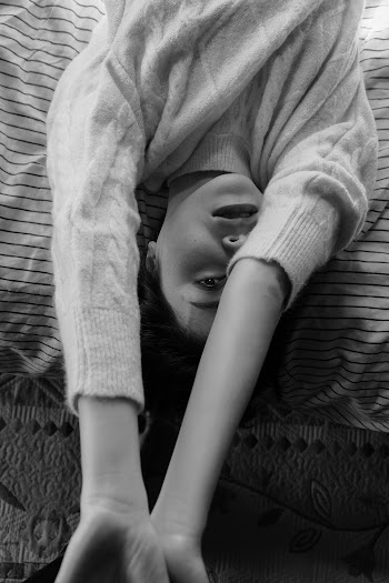 Woman Lying Down on Bed