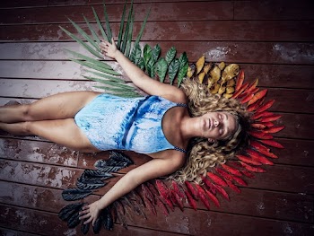 Woman Lying Down on Brown Floor With Leaves