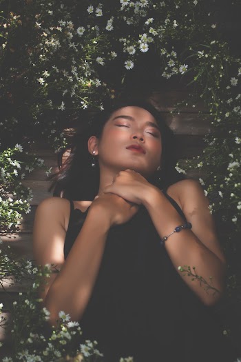 Woman Lying Down on Ground