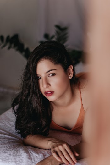 Woman Lying Forward on White Textile