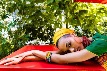 Woman Lying Her Head on Red Tabletop