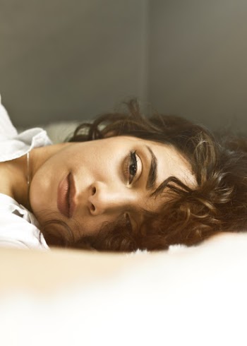 Woman Lying on Bed