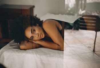 Woman Lying on Bed