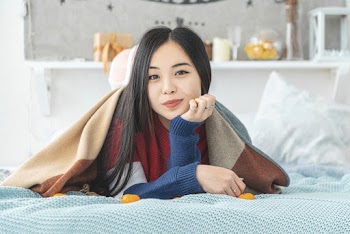 Woman Lying on Bed