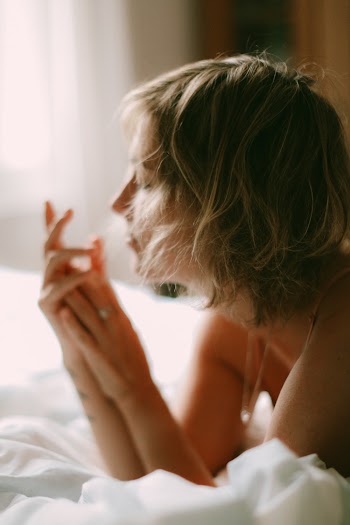 Woman Lying on Bed