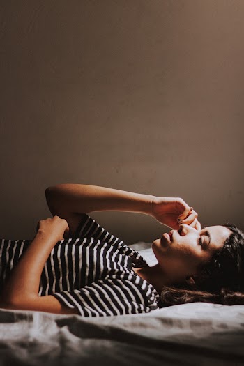 Woman Lying On Bed