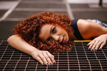 Woman Lying on Black Rubber Mat