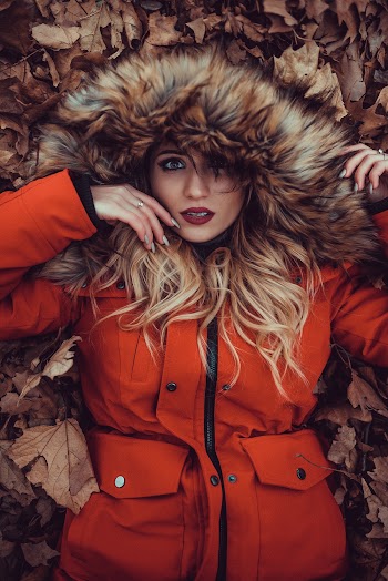 Woman Lying on Brown Withered Leaves