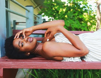 Woman Lying on Brown Wooden Bench
