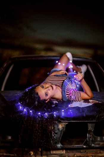 Woman Lying on Car Hood