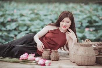 Woman Lying on Floor Near Baskets