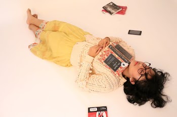 Woman Lying on Floor With Book on Chest