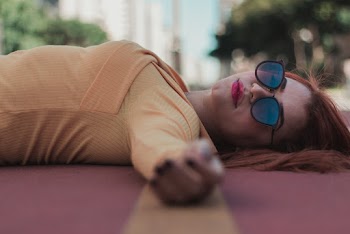 Woman Lying on Ground