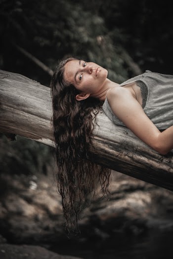 Woman Lying on Log