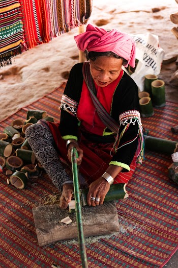 Woman Lying on Mat Holding Cutting Tool