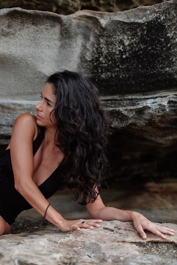 Woman Lying on Rock