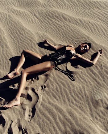 Woman Lying on Sand