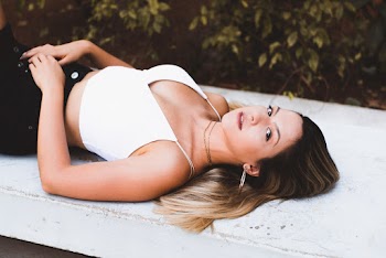 Woman Lying on White Surface