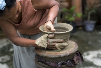 Woman Making Clay Jar