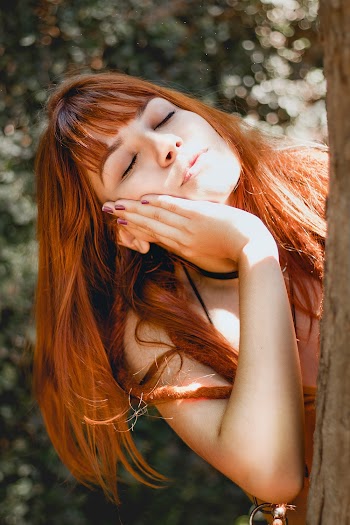 Woman Making Face Near Tree