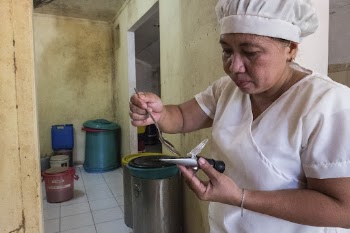 Woman making soup, local kitchen, | Free Photo - rawpixel