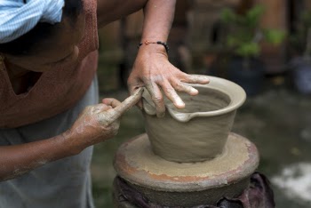 Woman Moldin Pot