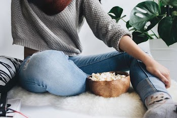 woman near brown bowl with dish