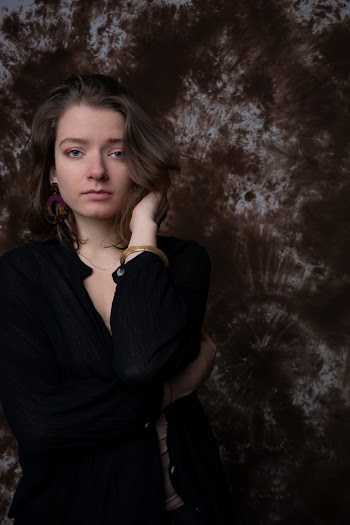Woman Near Brown Wall
