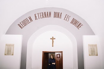 Woman Near Church Door