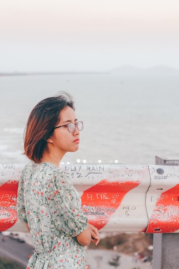 Woman Near Fence on Seashore